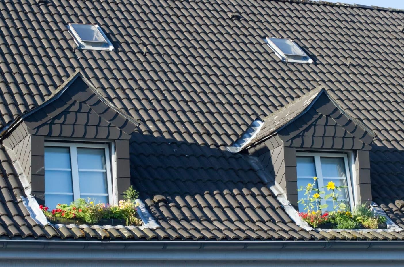 Dark tile roof with dormers